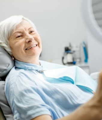 Senior woman smiling in dental chair