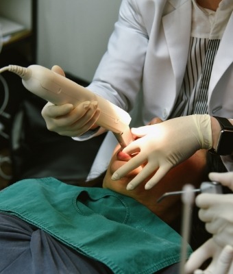 Dentist capturing digital dental impressions of a patient