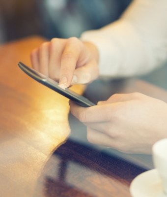 Person scrolling on their phone