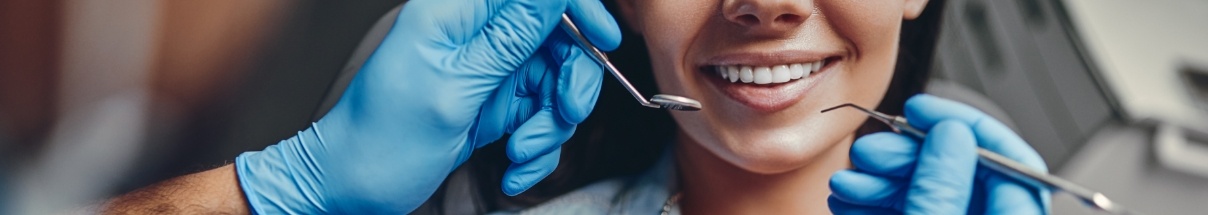 Close up of woman smiling while receiving dental services in Claremore