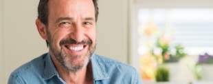 Smiling man in denim shirt