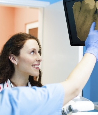 Dentist showing a patient their dental x rays