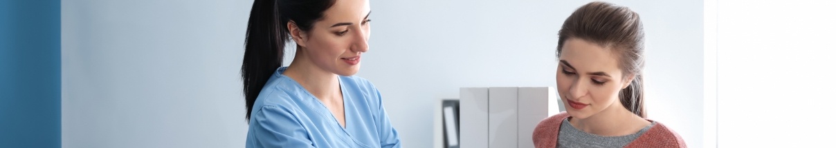 Dental team member talking to a patient